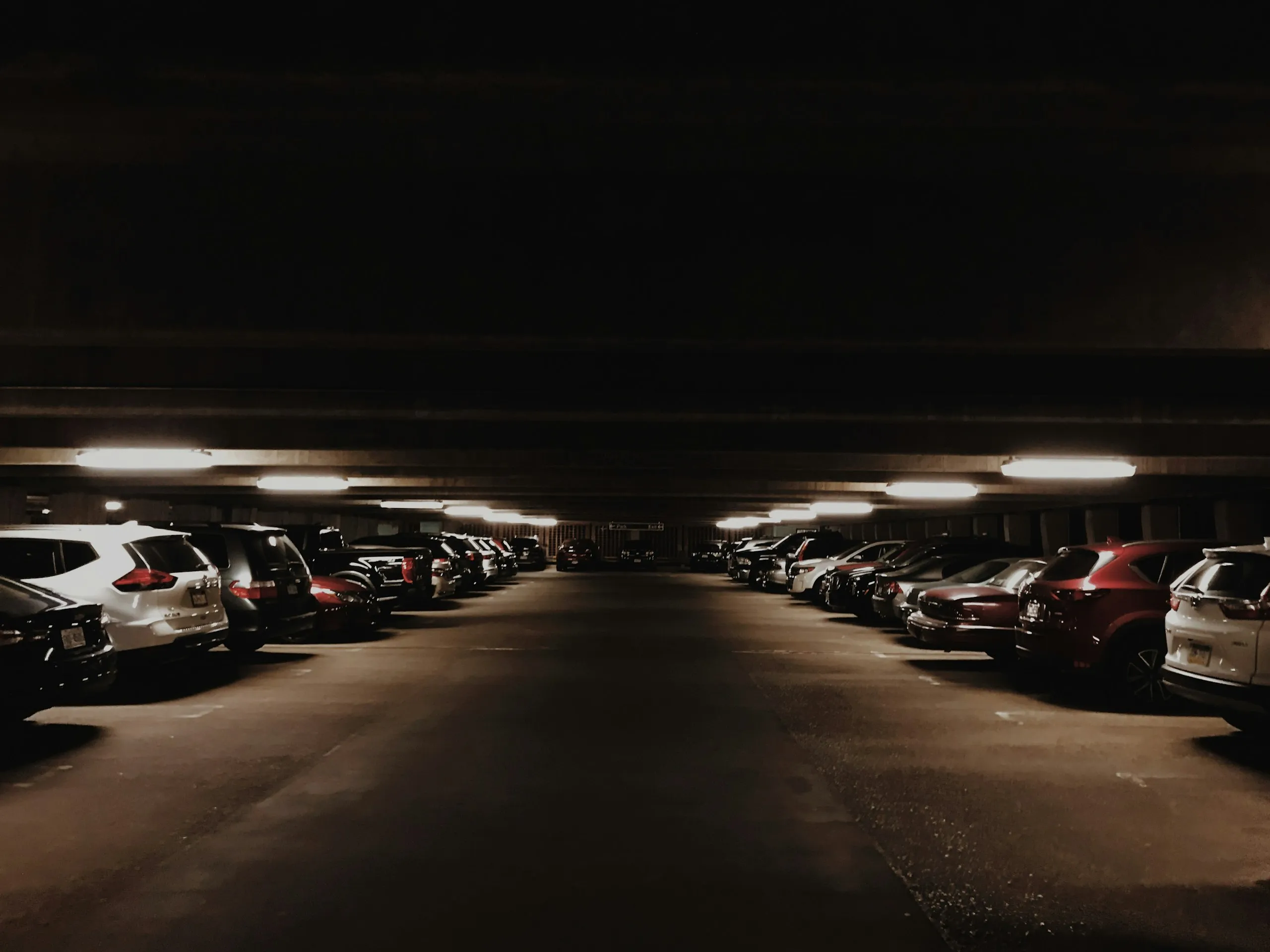 Cars parked in an underground parking facility